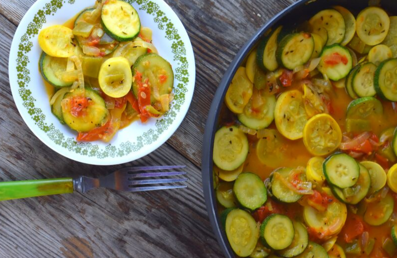Stewed Summer Squash and Tomatoes is a light side dish that can be served along the meat of your choice or eaten alone for a vegetarian option.  A base of onions, tomatoes and peppers compliment zucchini and yellow squash, and it's made in one skillet, making kitchen clean-up a cinch. 