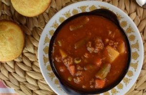 Hamburger Vegetable Soup with V8 Juice is the perfect meal for hungry kids and adults. With 5 simple ingredients, you can have a warm, hearty, family-pleasing soup on the table.  Using a bottle of V8 and a bag of frozen vegetables makes this meal totally doable for a busy weeknight.