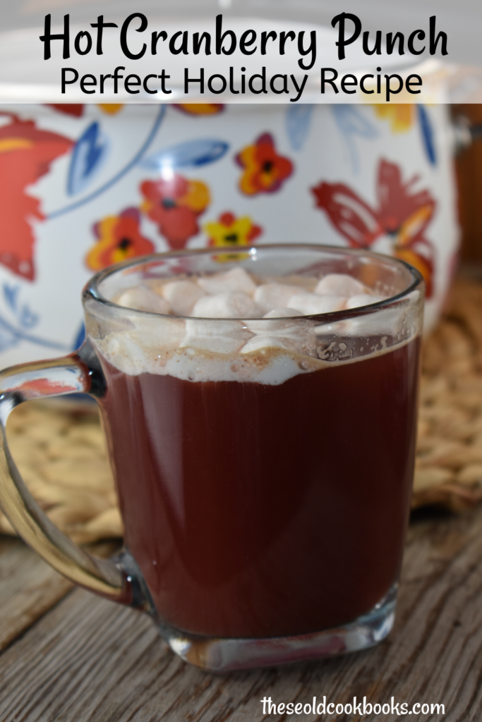 Hot Cranberry punch is a non alcoholic hot punch recipe that blends cranberry, apple and orange juices with fall spices for the perfect holiday beverage.