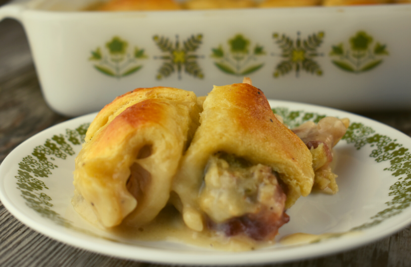 Leftover Thanksgiving Crescent Casserole takes all your favorite holiday leftovers and creates a brand new delicious meal.  Use up that leftover turkey, cranberry sauce and dressing by stuffing it in a canned crescent roll and baking in a yummy sauce of leftover gravy and milk.  
