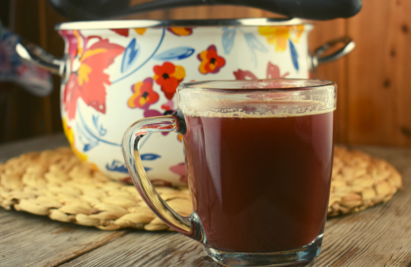 Hot Cranberry punch is a non alcoholic hot punch recipe that blends cranberry, apple and orange juices with fall spices for the perfect holiday beverage.