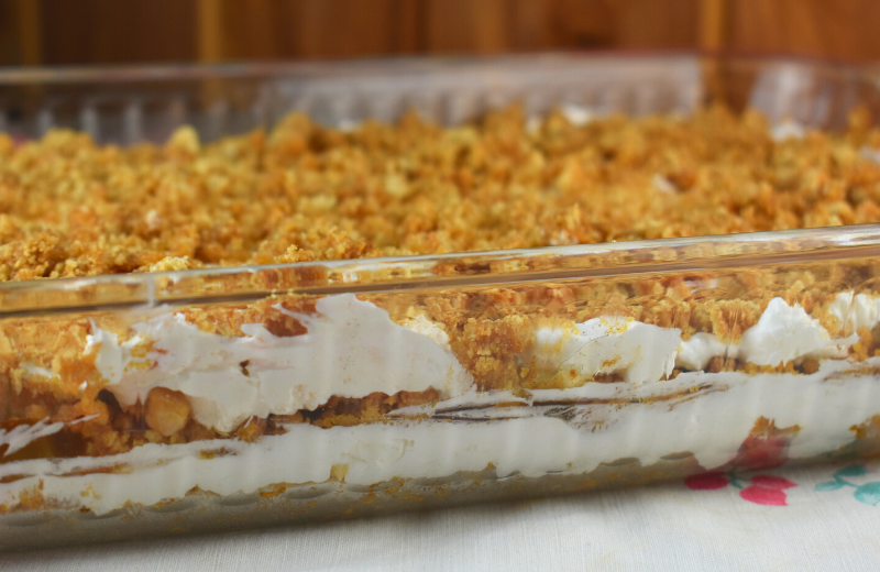 No Bake Apple Cheesecake Salad is a six layer, no bake dessert that features a list of the best dessert ingredients: peanut butter, graham crackers, apple pie filling, whipped topping, and cream cheese.  This easy fluff recipe will be a hit at your next party or get-together. 