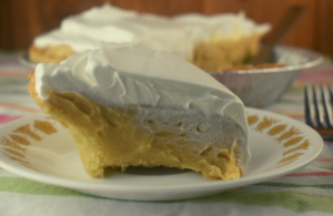 Old Fashioned Peanut Butter Pie is a from scratch pudding pie that has a decadent peanut butter flavor and smooth, creamy texture.  You may never buy a boxed pudding mix again after making this easy pudding filling. 