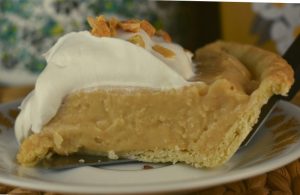 Old Fashioned Peanut Butter Pie is a from scratch pudding pie that has a decadent peanut butter flavor and smooth, creamy texture.  Homemade peanut butter pie from scratch is easy as pie. You may never buy a boxed pudding mix again after making this easy pudding filling.