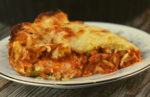 Impossible Chicken Parmesan Pie is impossibly easy to throw together for a quick weeknight meal.  Three layers of cheesy goodness combine to form a pizza pie that the whole family will love. 