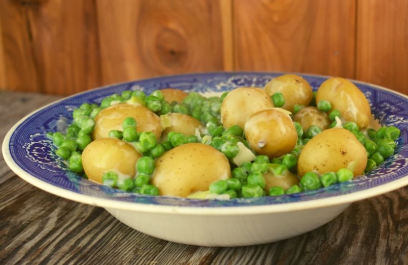 Creamed Peas and New Potatoes come together quickly on the stove-top and pair perfectly along side of any entree.  This old fashioned side dish tastes just like Mom or Grandma made it.