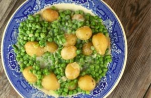 Creamed Peas and New Potatoes come together quickly on the stove-top and pair perfectly along side of any entree.  This old fashioned side dish tastes just like Mom or Grandma made it.