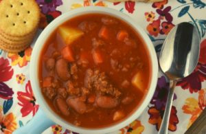 Poor Man's Stew is an old-fashioned recipe that was found on the table of many Midwestern tables. It's a hearty combination ground beef, potatoes, carrots and red kidney beans in a base of tomato juice. While it may seem simple, don't discount its delicious flavor.