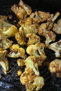 Air Fryer Cauliflower is seasoned perfectly with a blend of garlic powder, paprika, salt and Parmesan cheese.  Roasted to perfection in the air fryer, it results in a low carb (or Keto) side dish that the whole family will love. Check out these instructions for how to make cauliflower in the air fryer (no breading).