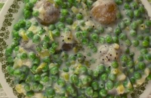 Creamed Peas and New Potatoes come together quickly on the stove top and pair perfectly along side any entrée.  This old fashioned creamed peas (without cream) dish tastes just like Mom or Grandma made it.