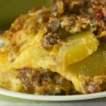 Potato Sausage Casserole consists of layers of sliced potatoes, ground pork sausage, and shredded cheese covered in a basic white sauce. Creamy Sausage Potato Bake is an easy casserole that is reminiscent of what Mom or Grandma would serve.