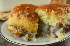 French Onion Sliders are a cheesy-topped ground beef sloppy Joe mixture baked on Hawaiian rolls and drizzled in an delectable butter sauce. Make them for dinner or for a party, but just know, your family will be begging for more. 