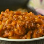 Ground Beef Pizza Casserole is a cheesy skillet meal that your family will love. It's a homemade hamburger helper with loads of pizza flavor.  Toss it together for a quick weeknight meal using easy pantry staples.