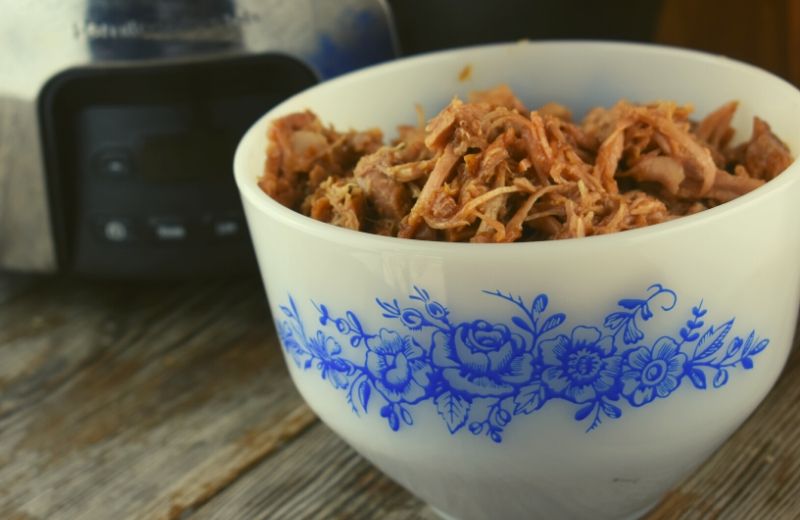 Quick Crock Pot Pulled Pork is a 3-ingredient entrée that can be tossed in the slow cooker in a matter of minutes. This simple meal packs a flavor punch with perfectly seasoned pork tossed in your favorite barbecue sauce.