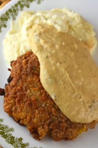Chicken Fried Steak (also known as Fried Cubed Steak or Country Fried Steak) is downright delicious.  This 20-minute meal consists of perfectly seasoned and breaded cubed steak that is pan fried and topped with homemade gravy.