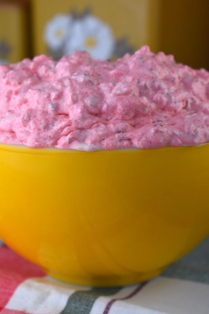 Pink Lady Salad is 5 ingredient vintage Jello salad that includes cottage cheese, canned pineapple and Cool Whip. Also known as Pink Stuff, this recipe creates one of those classic dishes that graced holiday dinner tables across the Midwest.