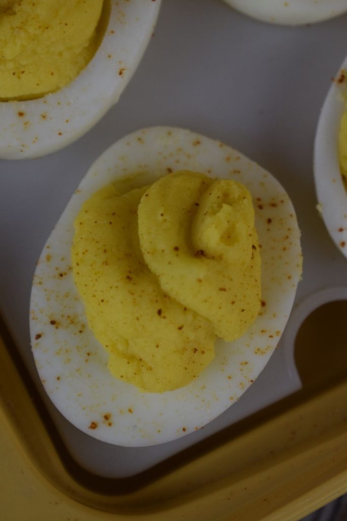 Grandma's Deviled Eggs are an old-fashioned version without relish. The creamy, yolk filling is a combination of sugar, vinegar, mustard and Miracle Whip. One bite of these will take you right back the holidays from your past.