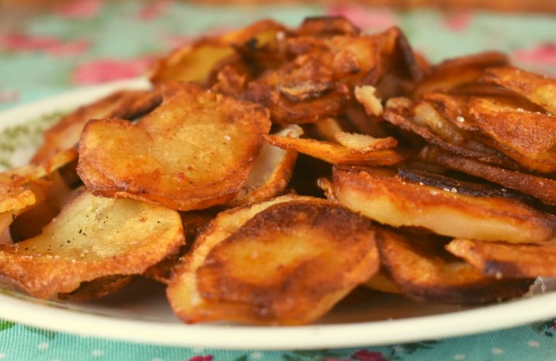 This Crispy Fried Potatoes recipe starts with raw potatoes and ends with a perfectly pan-fried potato.  Serve with ketchup for the perfect side dish.