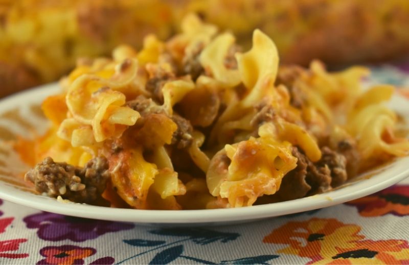 Ground Beef and Noodles Bake has everything kids love---hamburger and egg noodles in a creamy sauce.  This easy recipe makes a huge casserole making it the perfect family-friendly dinner recipe. 