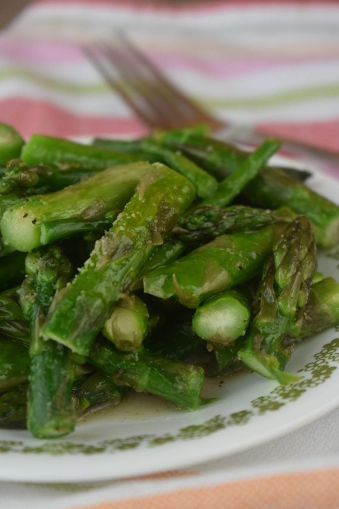 This Perfect Microwave Asparagus recipe is quick and easy. Microwave Asparagus with olive oil is served in less than 5 minutes.
