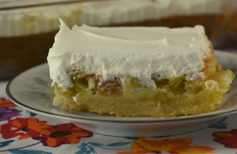 What's better than a dream? Layers of buttery shortbread, rich rhubarb custard and cool whipped topping make this Rhubarb Dream Cake a favorite of among all rhubarb recipes.