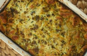Breakfast is served with this egg casserole full of sausage, cheese, bread cubes and a secret ingredient---zucchini.  That's right, trick your kids into eating their veggies in the morning with this breakfast casserole with zucchini. 