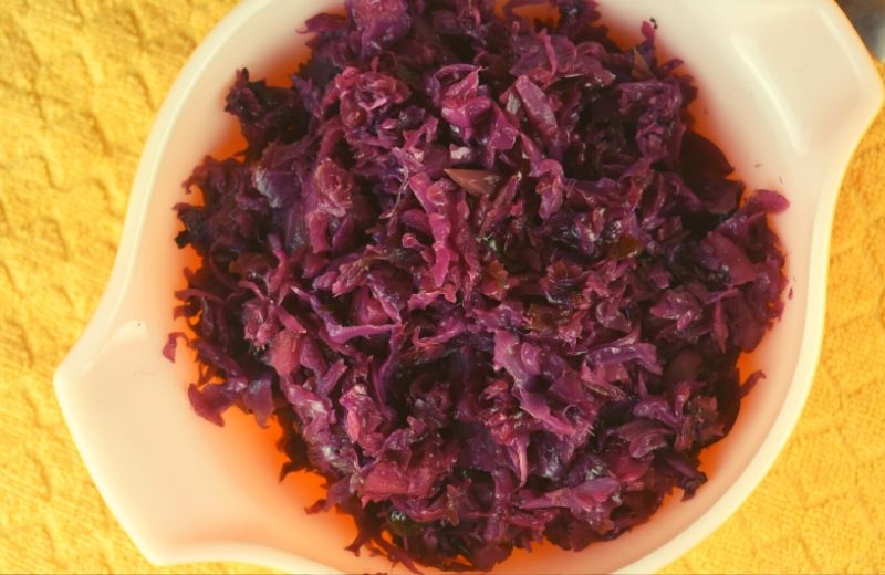 Don't wait until Oktoberfest to make this German-Style Red Cabbage. Braised in a skillet with green apples and a hint of cloves, this recipe is a hit with all ages. 