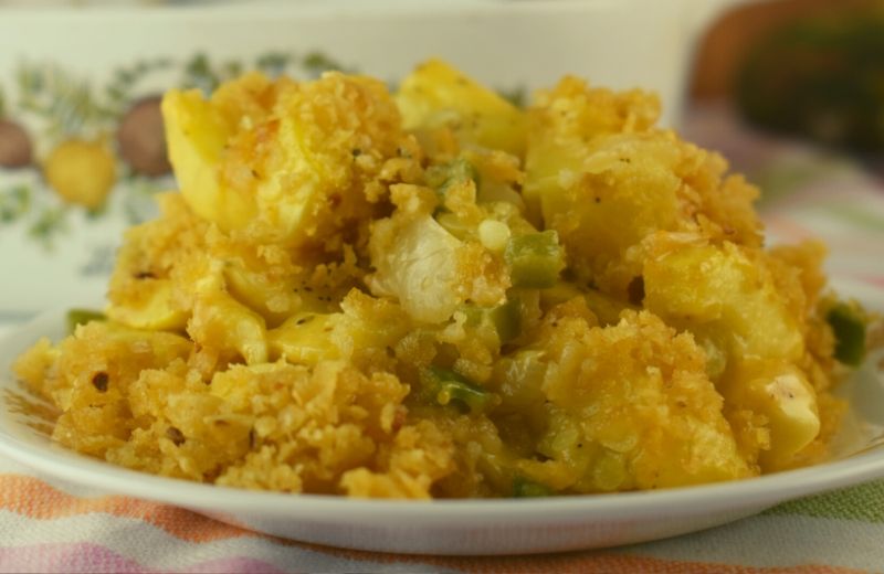 Texas Jalapeno Squash Casserole is a new take on our favorite yellow squash casserole featuring diced jalapeno for a bit of heat and crushed Frito chips for a crunchy topping.