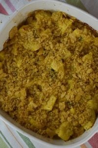 Texas Jalapeno Squash Casserole is a new take on our favorite yellow squash casserole featuring diced jalapeno for a bit of heat and crushed Frito chips for a crunchy topping.  Summer squash casserole (no crackers) is a great summer side dish. 