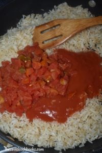 Authentic Spanish Rice may be traditional but it's also simple with just a handful of ingredients including long-grain white rice, water, chicken broth, tomato sauce and Rotel canned tomatoes. With a lot of stirring and a little patience, you too will master this easy side dish. 
