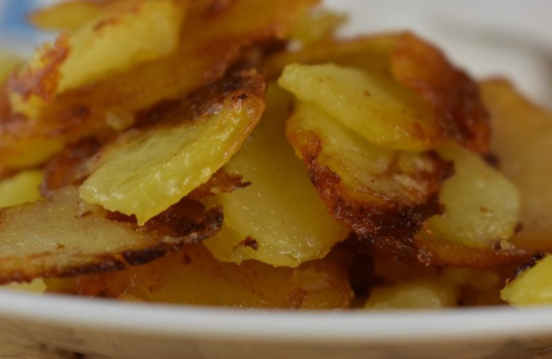Crispy Fried Potatoes starts with raw potatoes and ends with a perfectly pan-fried potato. Serve old fashioned fried potatoes with ketchup.