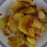 Crispy Fried Potatoes starts with raw potatoes and ends with a perfectly pan-fried potato. Serve old fashioned fried potatoes with ketchup.