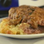 This dump and serve Crock Pot Cubed Steak & Mashed Potatoes is unique.  The mashed potatoes are layered underneath the meat, and the gravy makes itself in the cooker.  Follow these simple steps on how to make cube steak in the crock pot in just 4 hours.
