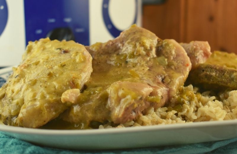 Mexican Style Crock Pot Pork Chops are a slowed cooked pork chop recipe in an easy 3 ingredient green chili sauce. Try serving over rice to absorb all the extra southwest flavor.  