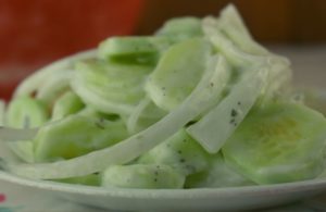 Simple Sour Cream Cucumbers is an old fashioned summer salad featuring garden cucumbers and onions. The sauce is a delightfully easy sour cream base flavored with with a pinch of tarragon. 