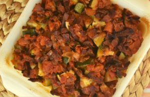Zucchini Tomato Bacon Bake is the a new spin on zucchini casserole.  Chunks of zucchini are baked in a homemade marinara sauce and topped with crispy bacon.