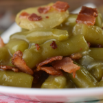 Pennsylvania Dutch Green Beans are a German-inspired side dish. Canned green beans are enhanced with water chestnuts, onions and bacon and baked in a slightly sweet and tangy sauce.