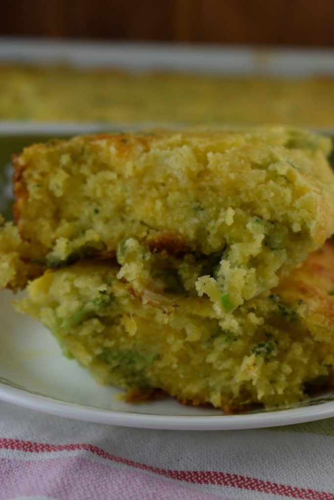 Broccoli Cornbread Bake is an easy broccoli cheddar casserole that uses Jiffy cornbread mix. The result is a cheesy broccoli cornbread that feeds a crowd so it is the perfect holiday side dish.