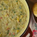 Debbie's Chicken Goop is a crustless chicken pot pie stew that gets served along side of biscuits. It's a hearty chicken dinner that will become a requested staple in your house.