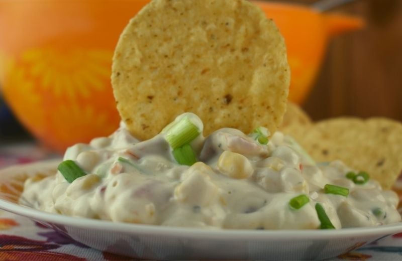 Mexicorn Crack Dip is a corn dip with Rotel and ranch seasonings.   With only six simple ingredients, it's an easy corn dip to prepare and easier to eat.  Serve at your next party or holiday with a bag of tortilla chips.  