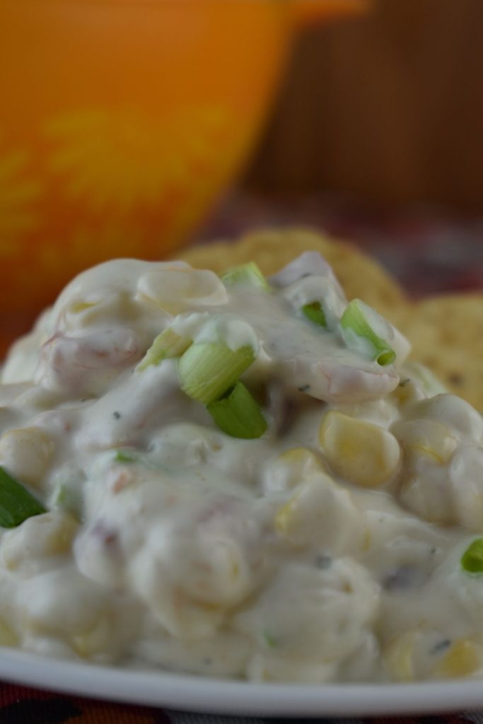 Mexicorn Crack Dip is a corn dip with Rotel and ranch seasonings. With only six simple ingredients, it's an easy corn dip to prepare and easier to eat.  Serve Mexicorn Dip with Rotel at your next party or holiday with a bag of tortilla chips.