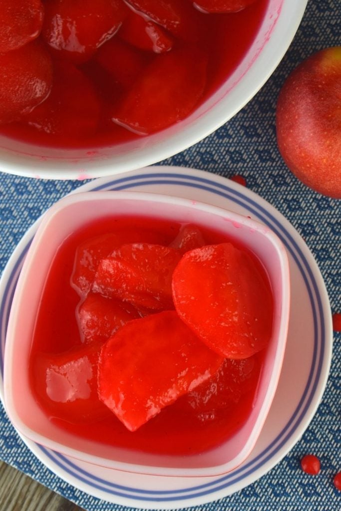 Using a cinnamon candy like Red Hots takes the guess-work out of this Red Hot Cinnamon Apples recipe. All you need is Cinnamon candies, sugar, water and apples.