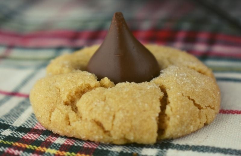 Old Fashioned Peanut Blossoms are called America's Favorite Christmas Cookie for a reason. They are the perfect marriage of peanut butter and chocolate, and kids go nuts for these classic holiday cookies. 