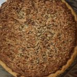 Southern Sweet Chocolate Pie is a homemade baked chocolate pie topped with chopped pecans and coconut.  It's all the flavors of your favorite German Chocolate Cake in a decadent pie.  This old fashioned chocolate pie is Grandma approved!