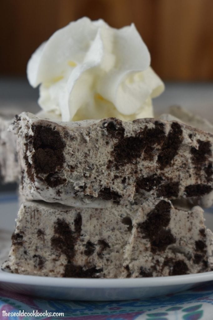 Oreo Ice Cream Cake is a perfectly easy 3 ingredient cookies and cream recipe. This ice cream cake features chunks of your favorite Oreo cookie to create a cookies and cream inspired dessert. With just a bit of prep time and patience, you will have a delicious frozen treat. 