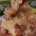 Cherry Rhubarb Crisp with sour cream is made in a 9x13 pan which serves a crowd.  Served alone or drizzle the rhubarb syrup over ice cream for an old fashioned dessert.  The addition of maraschino cherries in this rhubarb crisp makes it extra special.