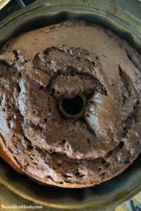Chocolate Kahlua Bundt Cake is a light and airy double chocolate cake doused in a sweet, boozy glaze.  It starts with a two shortcut ingredients, cake mix and pudding mix and is jazzed up with two types of booze, Kahlua and Crème de Cacao. Traditionally, this boozy chocolate cake is called a Black Russian Cake.