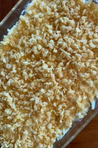 Potato Casserole with Rice Krispies is a cheesy hash brown casserole with a crispy, crunchy topping.  Often called Funeral Potatoes, this is the perfect side dish for almost any entrée. 