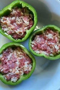 Old Fashioned Stuffed Bell Peppers is a simple stuffed pepper recipe with cooked rice and ground beef.  With only five ingredients, including a simple sauce of tomato sauce, this basic recipe is anything but simple in flavor. 