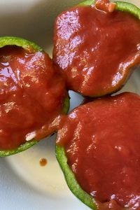 Old Fashioned Stuffed Bell Peppers is a simple stuffed pepper recipe with cooked rice and ground beef.  With only five ingredients, including a simple sauce of tomato sauce, this basic recipe is anything but simple in flavor. 